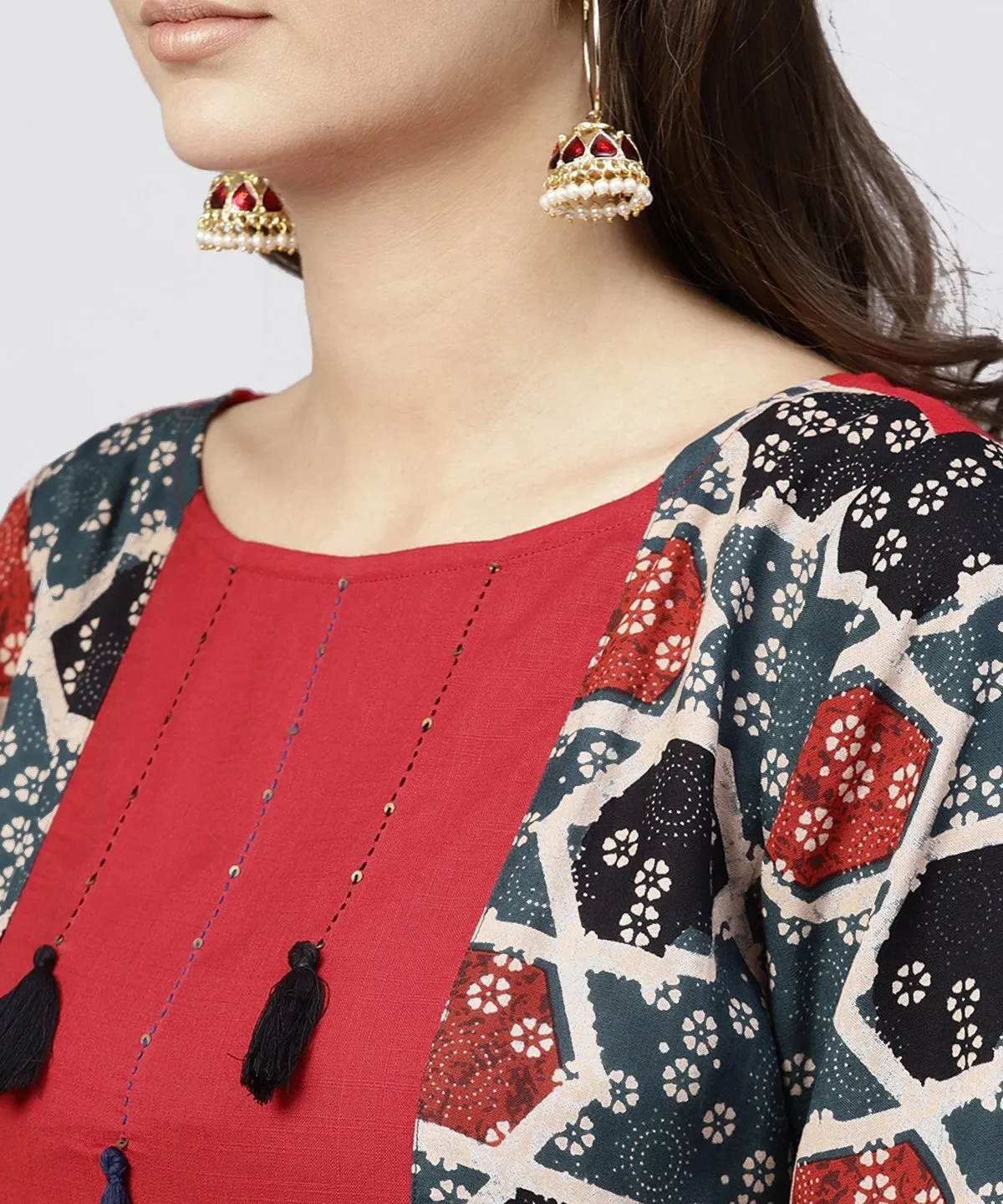 Red Cotton Full Sleeves Kurti With An Attached Jacket And Emblished With Thread Work And Tassel